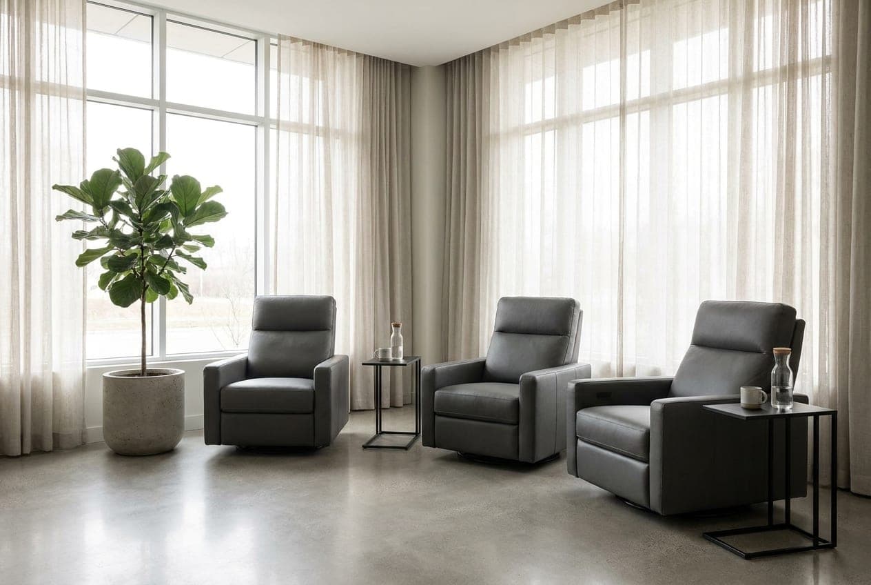 The Lumera wellness lounge — reclining chairs in a relaxed semi-circle by a wall of windows
